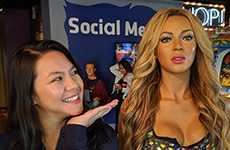 Trang Phan in 2022, posing next to Beyonce's wax figure