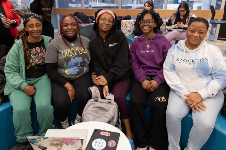 students sitting at panel discussion