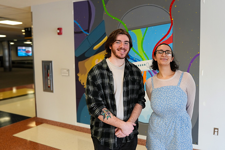 Evan Carr and Laura Randall in the Atlantic City airport terminal where their artwork hangs