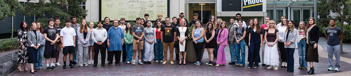 A group of students and faculty in Independence Plaza