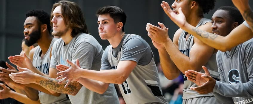 basketball platers cheering on teammates
