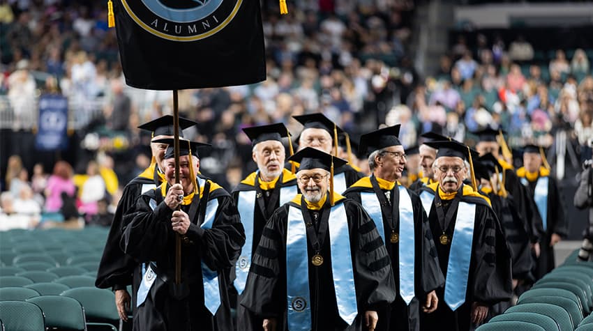 Golden Ospreys of 2026 leading procession at Commencement