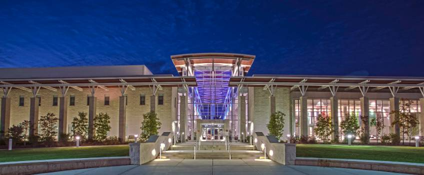 View of the Stockton University Campus Center illuminated at night