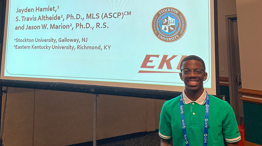 Jayden Hamlet during the CSTE Annual Conference in June; he's wearing a green polo and blue CSTE lanyard, smiling for the camera 