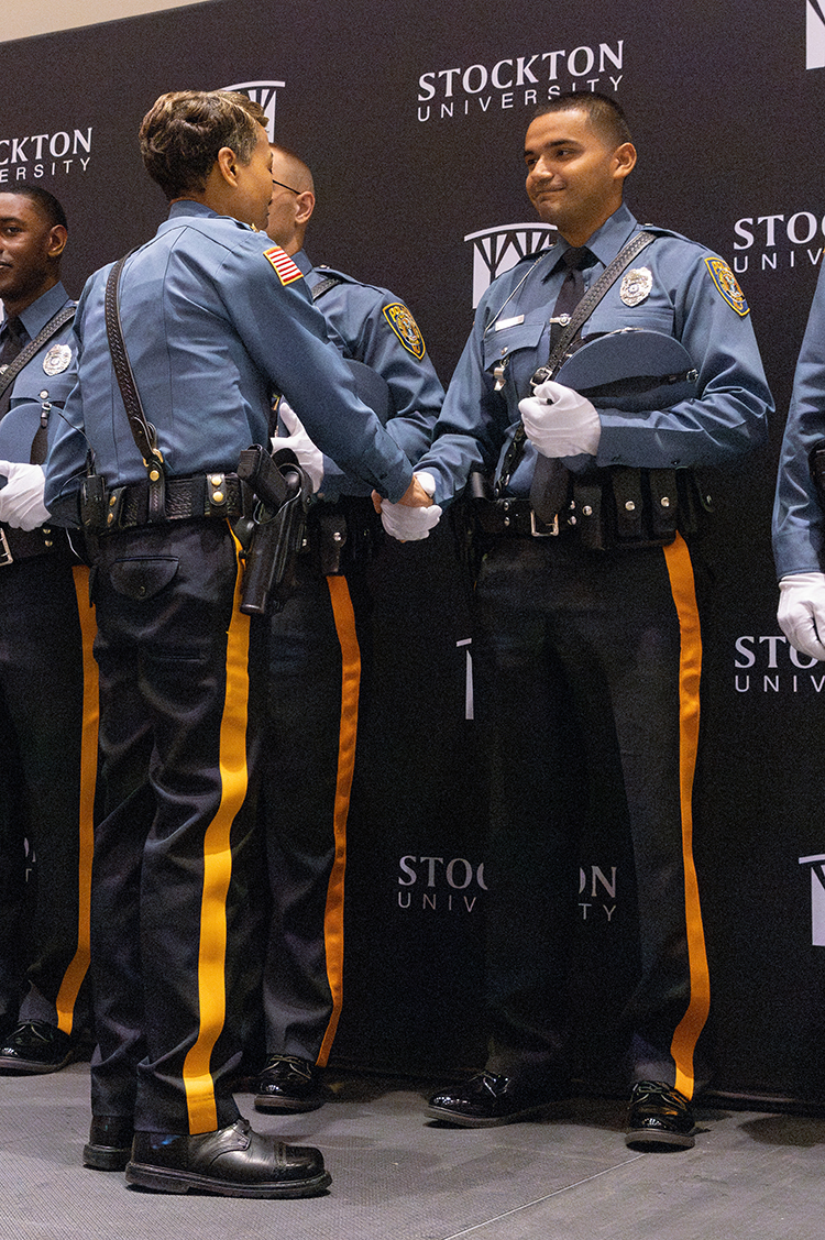 Stockton Police Chief Tracy Stuart congratulates new officer Numa Rodriguez-Rojas