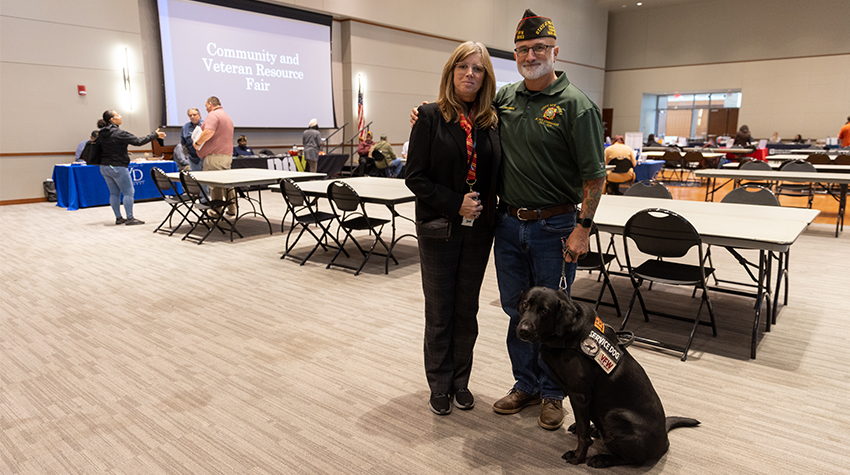 The Hinkers: Jacqueline, Jon and Xena, their service dog.