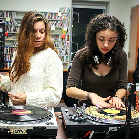 Two students in WLFR, our radio station 