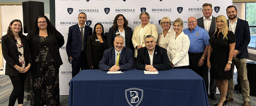 Stockton and Brookdale Community College leadership during transfer pathway signing.