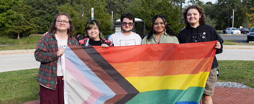 Students at LGBTQ+ History Month Flag Raising