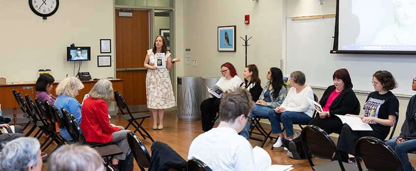 woman speaking in classroom to attendees