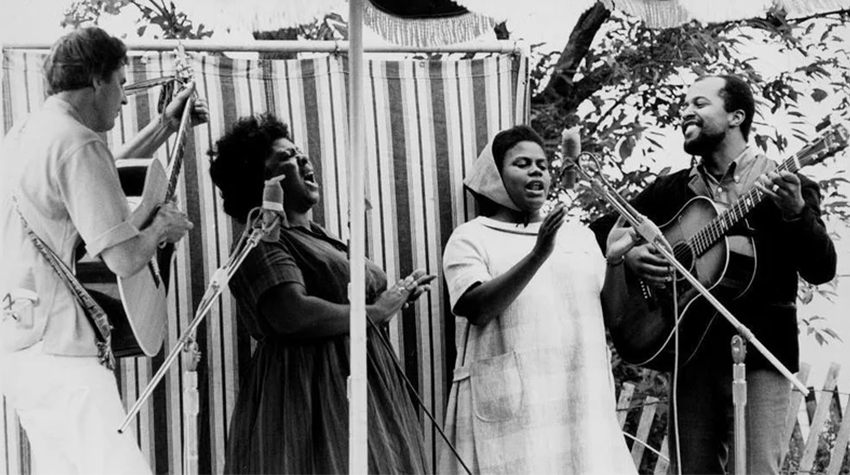 Guy Carawan, Fannie Lou Hamer, Bernice Johnson Reagon, and Len Chandler perform Civil Rights songs at the 1965 Newport Folk Festival.